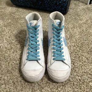 Nike White Sneakers with Blue Details